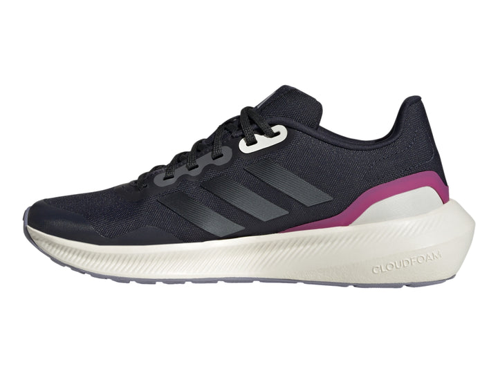 Tenis deportivos Adidas color azul marino con suela blanca y detalle fucsia en el talón.