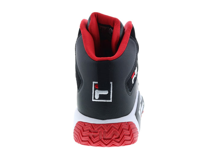 Tenis de baloncesto FILA MB color negro con patrones geométricos blancos y suela roja.