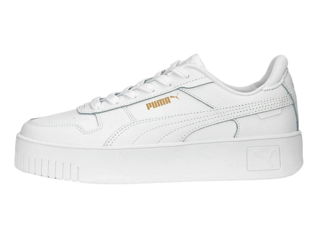 Tenis PUMA Carina Street color blanco con suela de plataforma.