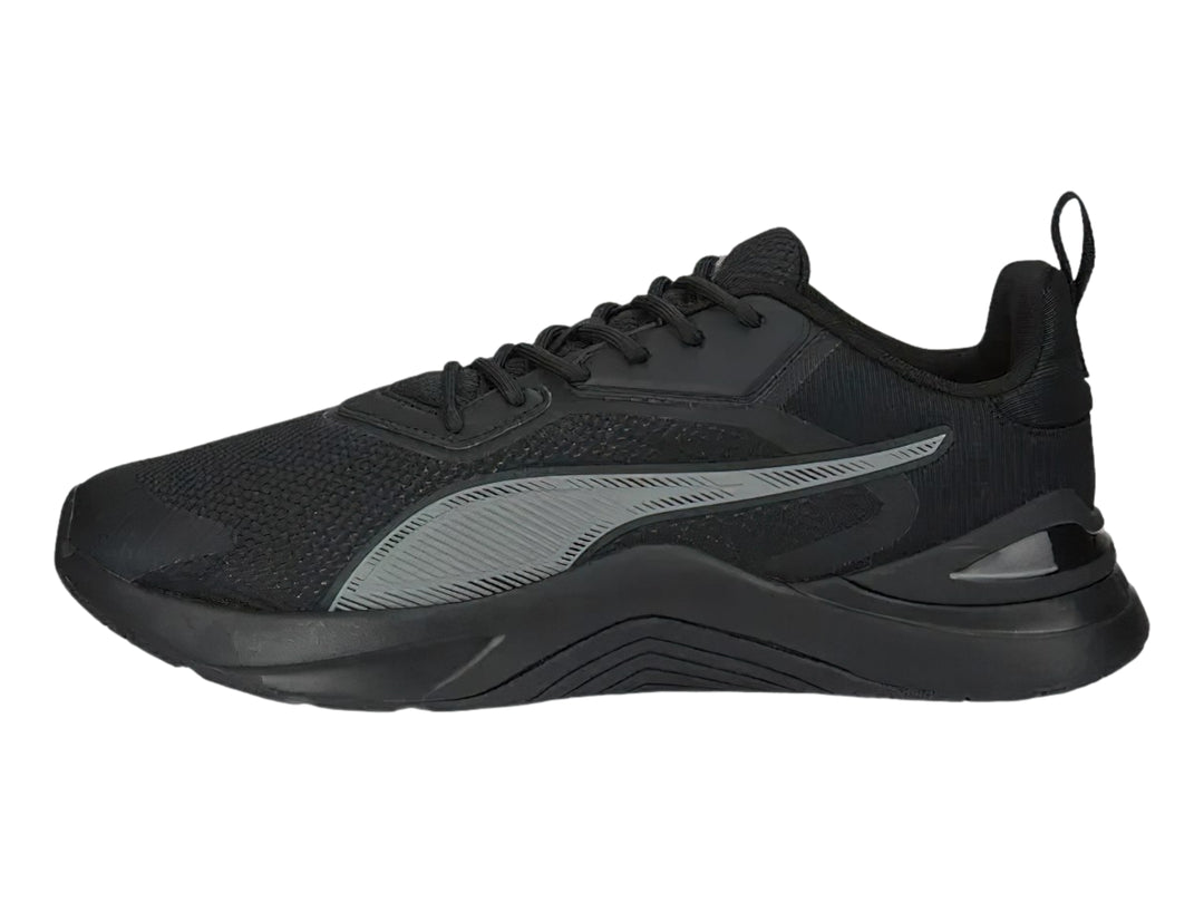 Tenis deportivos PUMA en color negro y gris oscuro con diseño moderno de malla y suela robusta.