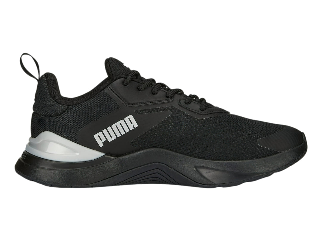 Tenis deportivos PUMA en color negro con detalles en plata y logotipo blanco lateral.