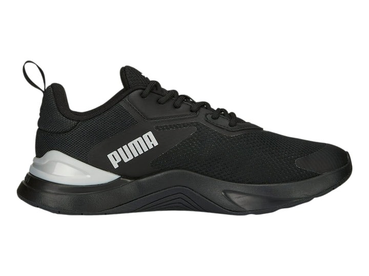Tenis deportivos PUMA en color negro con detalles en plata y logotipo blanco lateral.