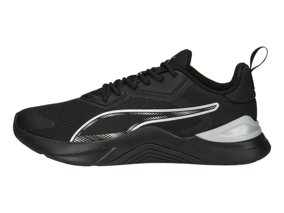 Tenis deportivos PUMA en color negro con detalles en plata y logotipo blanco lateral.