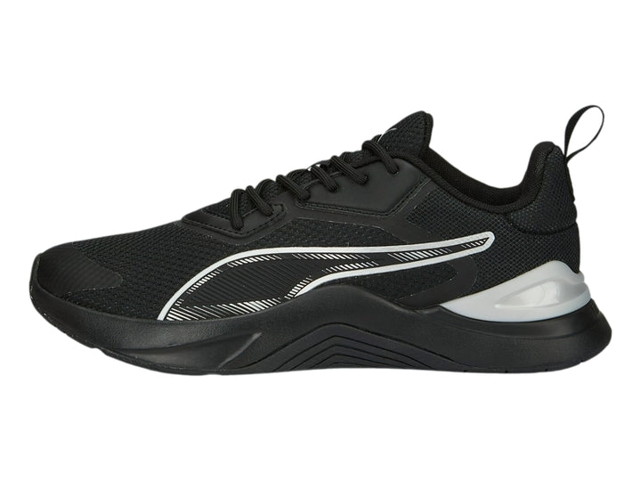 Tenis deportivos PUMA en color negro con detalles en plata y logotipo blanco lateral.