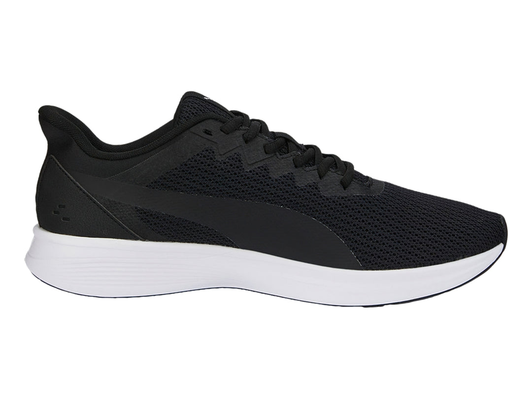 Tenis PUMA Transport Modern color negro con suela blanca y tejido de malla.