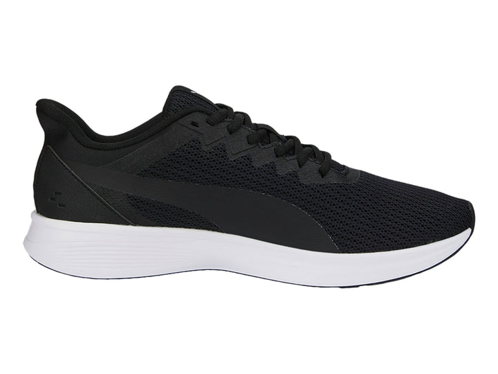 Tenis PUMA Transport Modern color negro con suela blanca y tejido de malla.
