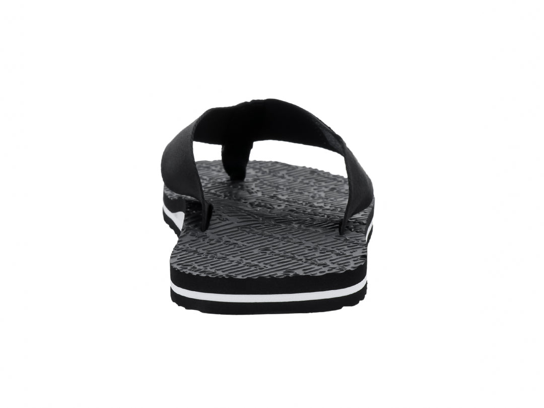Sandalias flip-flop negras de Calvin Klein con correa de tela y suela texturizada con detalle blanco.