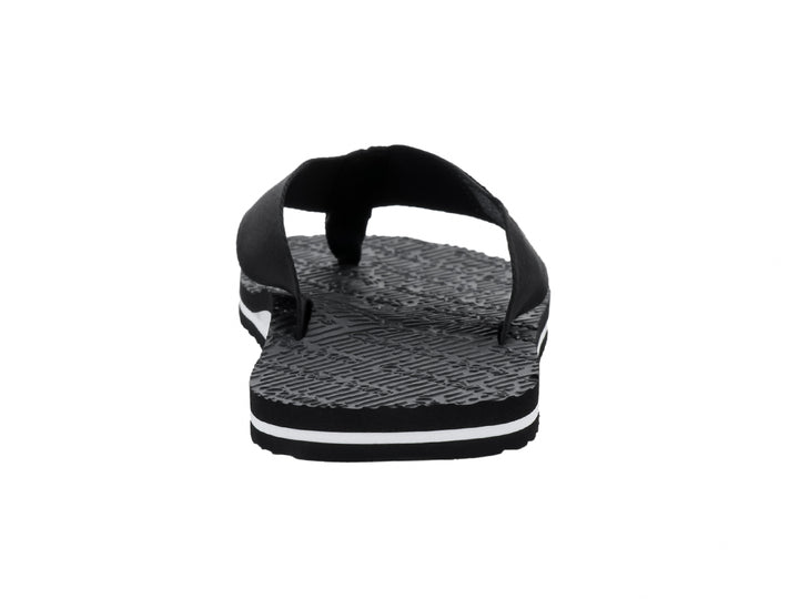 Sandalias flip-flop negras de Calvin Klein con correa de tela y suela texturizada con detalle blanco.