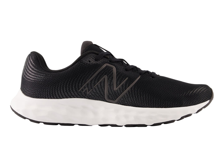 Tenis deportivos New Balance en color negro con suela blanca y tejido de malla.