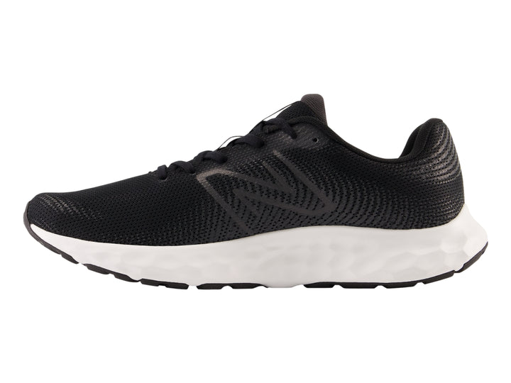Tenis deportivos New Balance en color negro con suela blanca y tejido de malla.