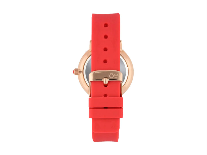 Reloj Cloe con correa color coral, caja en tono oro rosa y esfera blanca con detalles geométricos.