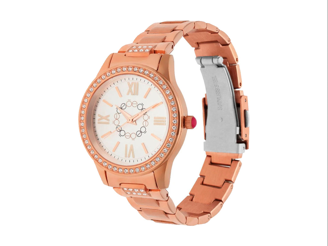 Reloj analógico Cloe color oro rosa con esfera blanca, números romanos y detalles de cristales.
