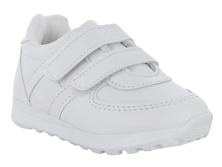 Zapato escolar blanco para niño con cierre de velcro y suela blanca.