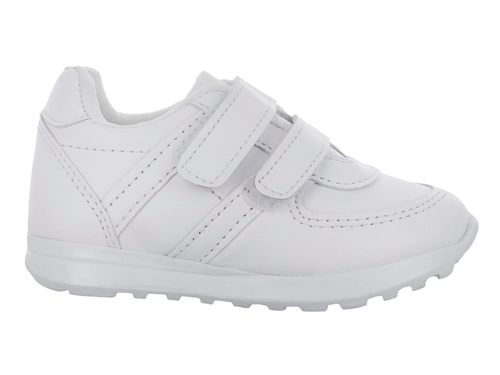 Zapato escolar blanco para niño con cierre de velcro y suela blanca.