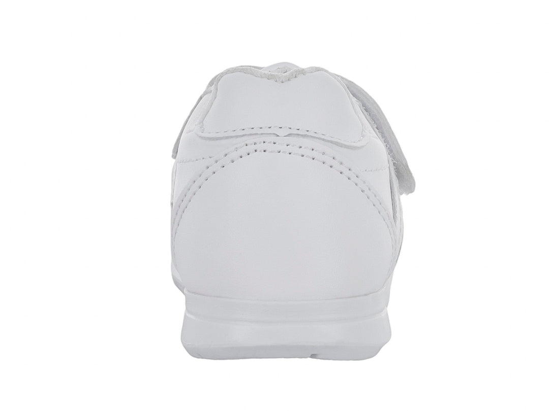 Zapato escolar blanco para niño con cierre de velcro y suela blanca.