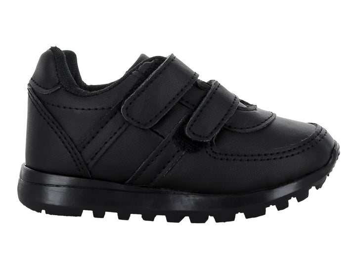 Zapato escolar negro para niño con cierres de velcro y suela dentada.