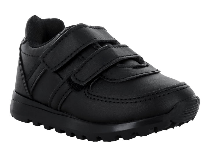 Zapato escolar negro para niño con cierre de velcro y suela dentada.