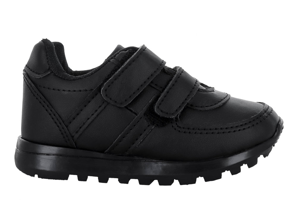 Zapato escolar negro para niño con cierre de velcro y suela dentada.