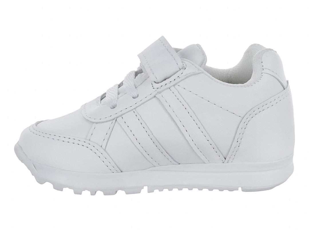 Tenis escolares blancos para niño o niña con cierre de velcro y agujetas.