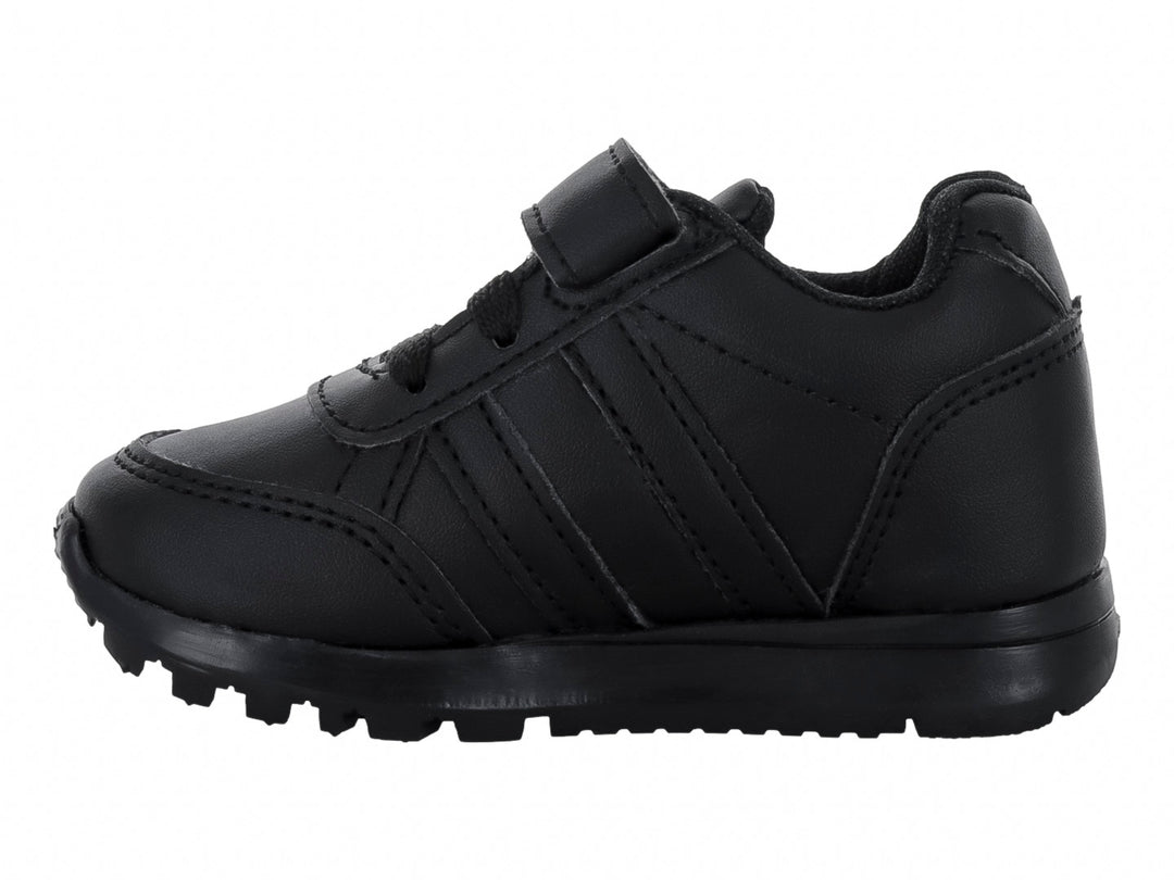 Zapato deportivo escolar color negro monocromático para Niño o Niña con cierre de velcro y suela dentada.