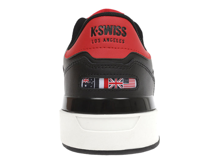 Tenis K-Swiss color negro con suela blanca y detalles rojos en la parte posterior.
