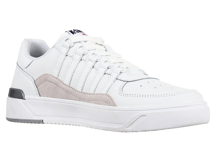 Tenis K-Swiss blancos con franja lateral gris y suela blanca, vista de perfil.