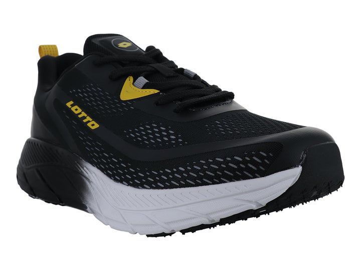 Tenis deportivos Lotto negros con detalles amarillos y suela blanca y negra.
