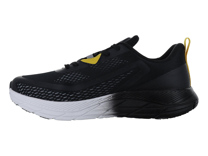 Tenis deportivos Lotto negros con detalles amarillos y suela blanca y negra.