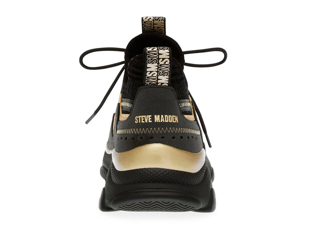 Tenis Steve Madden Match Box en color negro con detalles dorados y suela chunky robusta.
