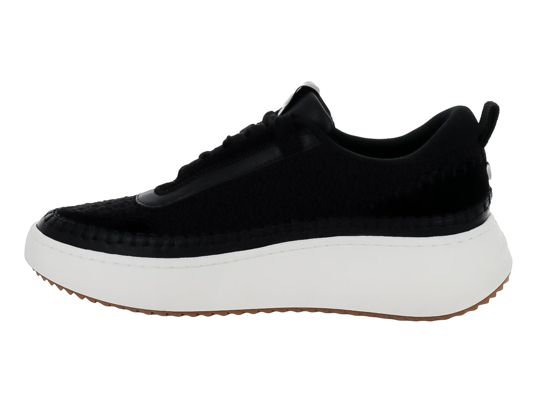Tenis Steve Madden Double Take en color negro con suela blanca gruesa y base café.
