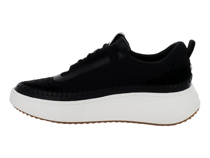 Tenis Steve Madden Double Take en color negro con suela blanca gruesa y base café.
