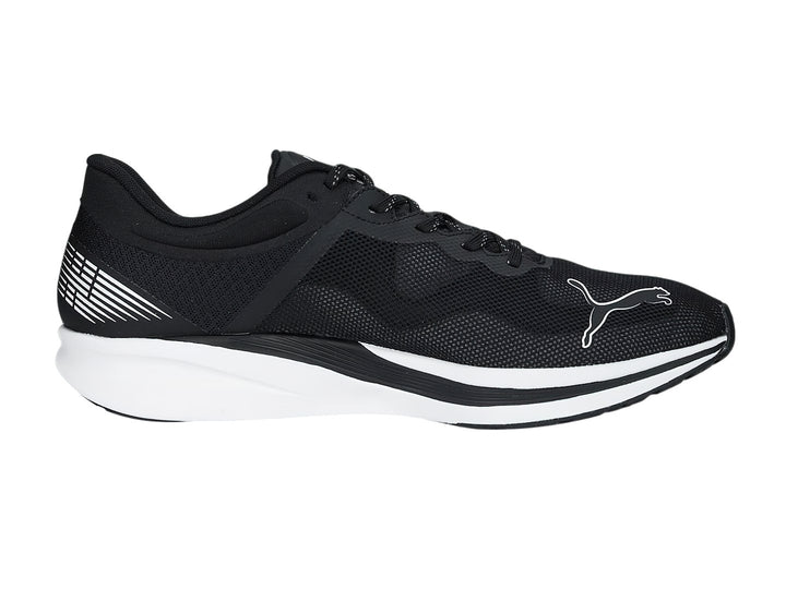 Tenis deportivos PUMA REDEEM PROFOAM color negro con suela blanca.