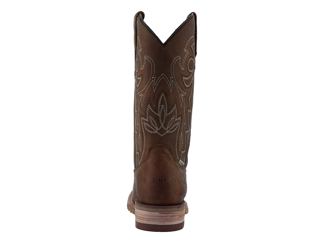 Bota vaquera de cuero color miel con bordados decorativos y suela robusta.