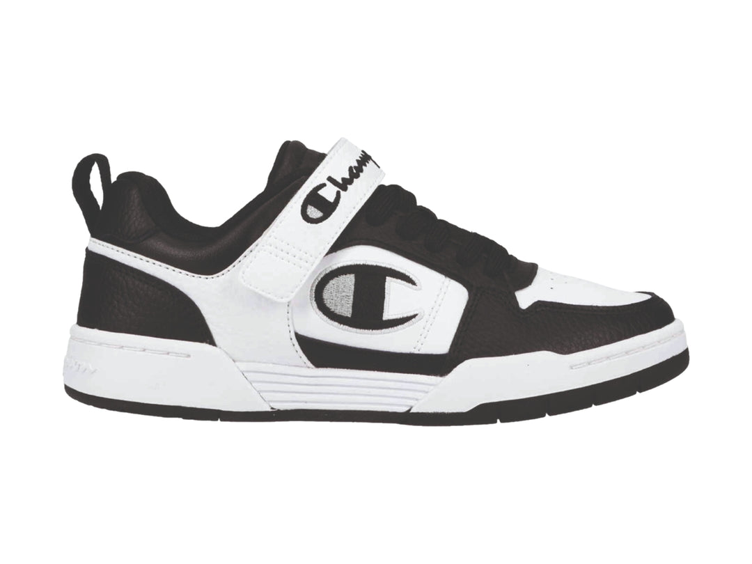 Tenis deportivos Champion Arena Power Lo en colores blanco y negro con correa ajustable.