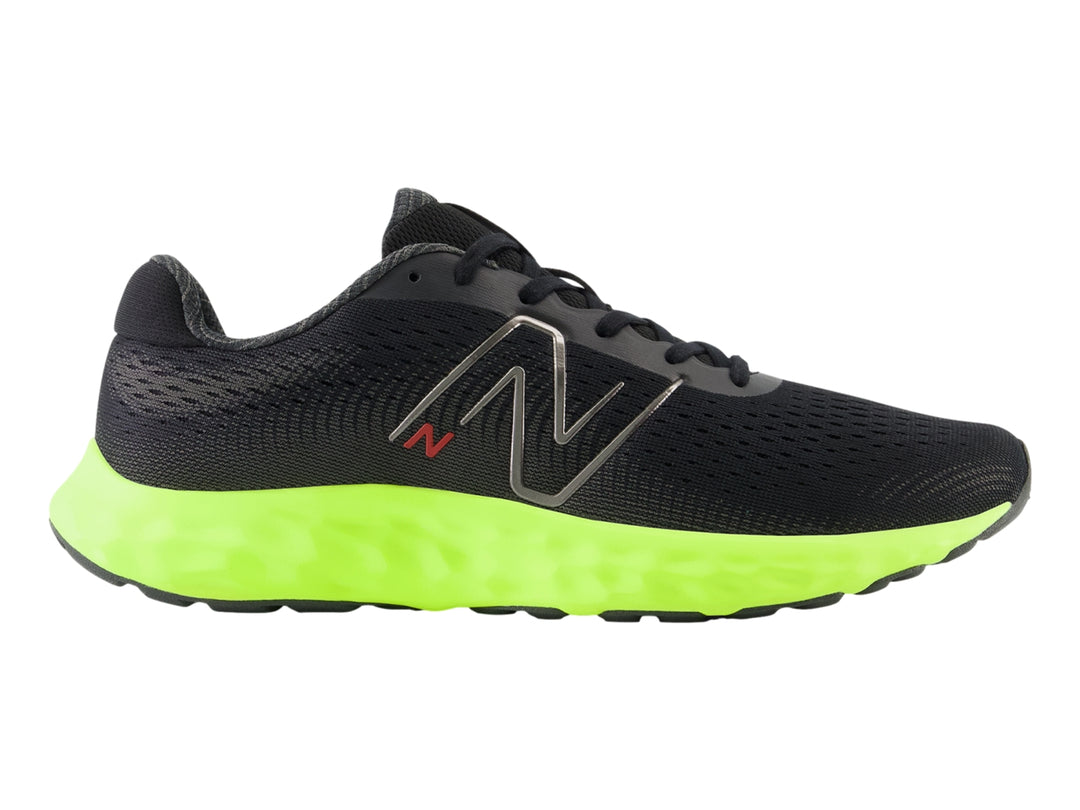 Tenis New Balance deportivos en color negro con suela gruesa verde neón y detalles en rojo.