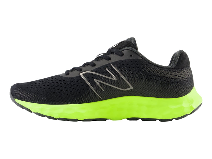 Tenis New Balance deportivos en color negro con suela gruesa verde neón y detalles en rojo.