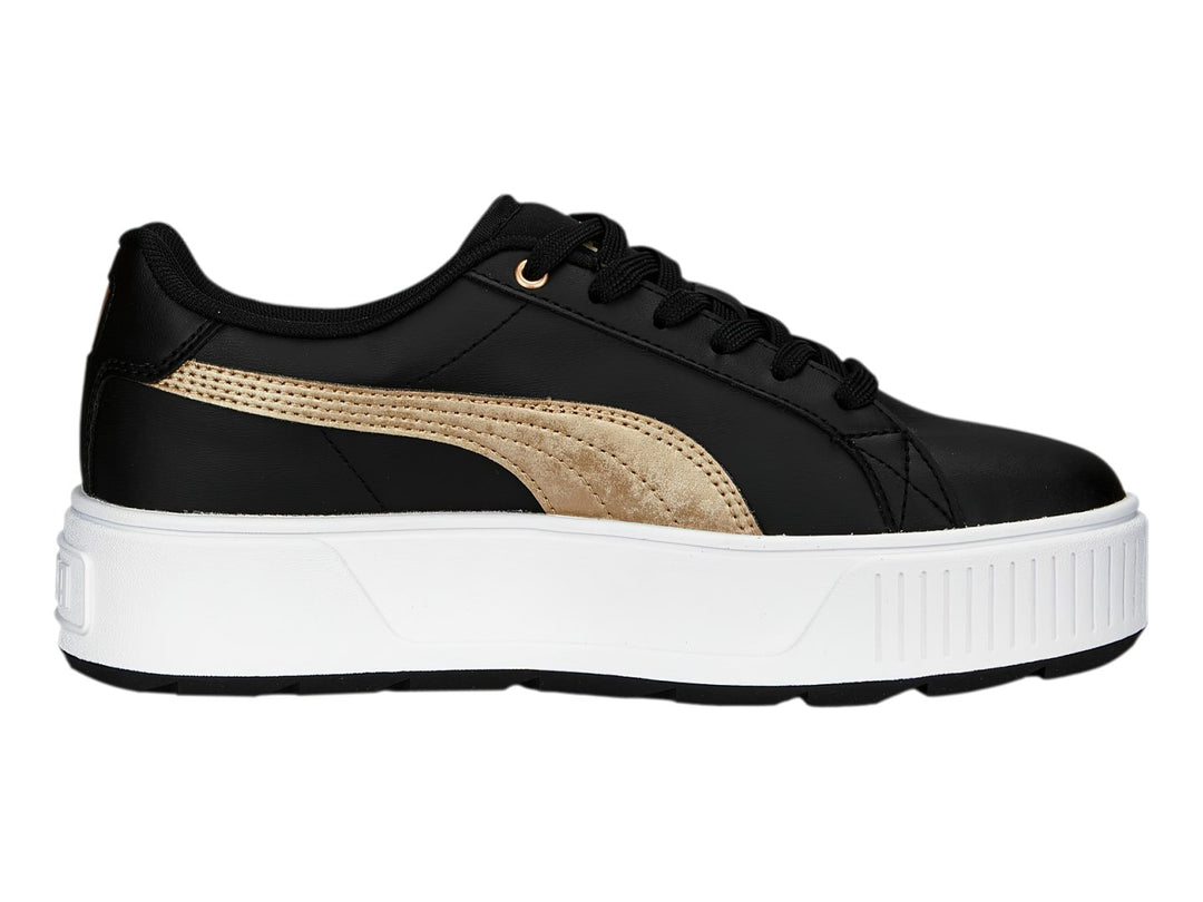 Tenis PUMA modelo Carmen Space Metallics en color negro con franja dorada y suela de plataforma blanca.