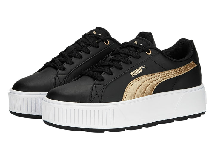 Tenis PUMA modelo Carmen Space Metallics en color negro con franja dorada y suela de plataforma blanca.