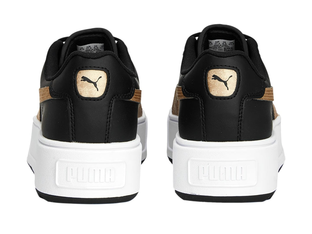 Tenis PUMA modelo Carmen Space Metallics en color negro con franja dorada y suela de plataforma blanca.