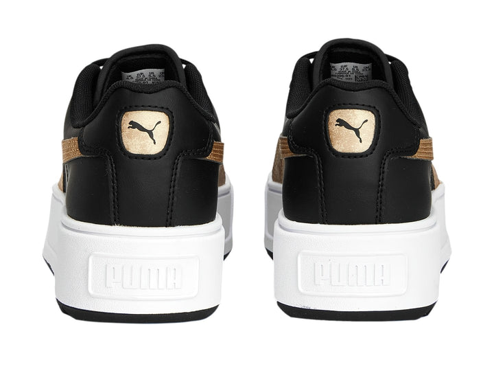 Tenis PUMA modelo Carmen Space Metallics en color negro con franja dorada y suela de plataforma blanca.
