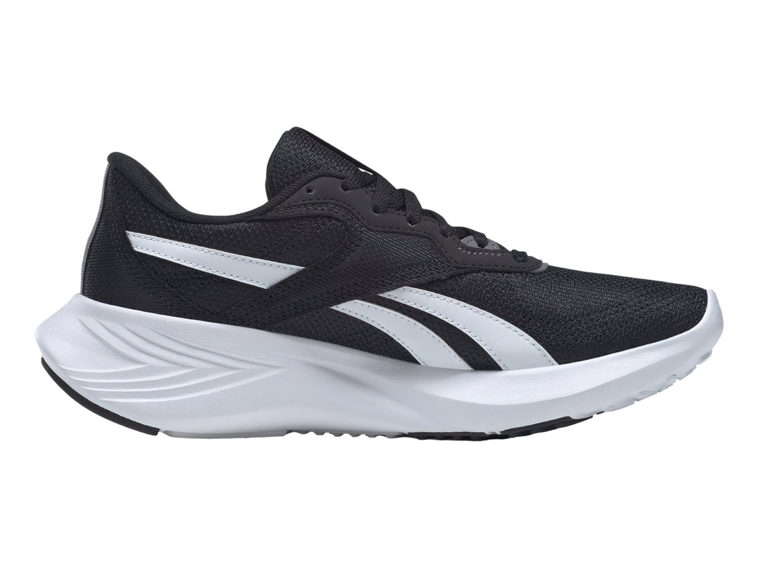 Tenis deportivos Reebok color negro con suela blanca y detalles laterales blancos.