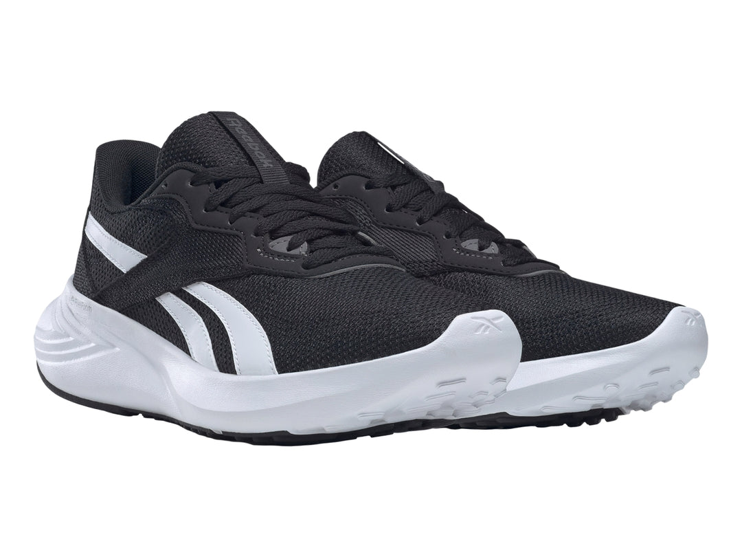 Tenis deportivos Reebok color negro con suela blanca y detalles laterales blancos.