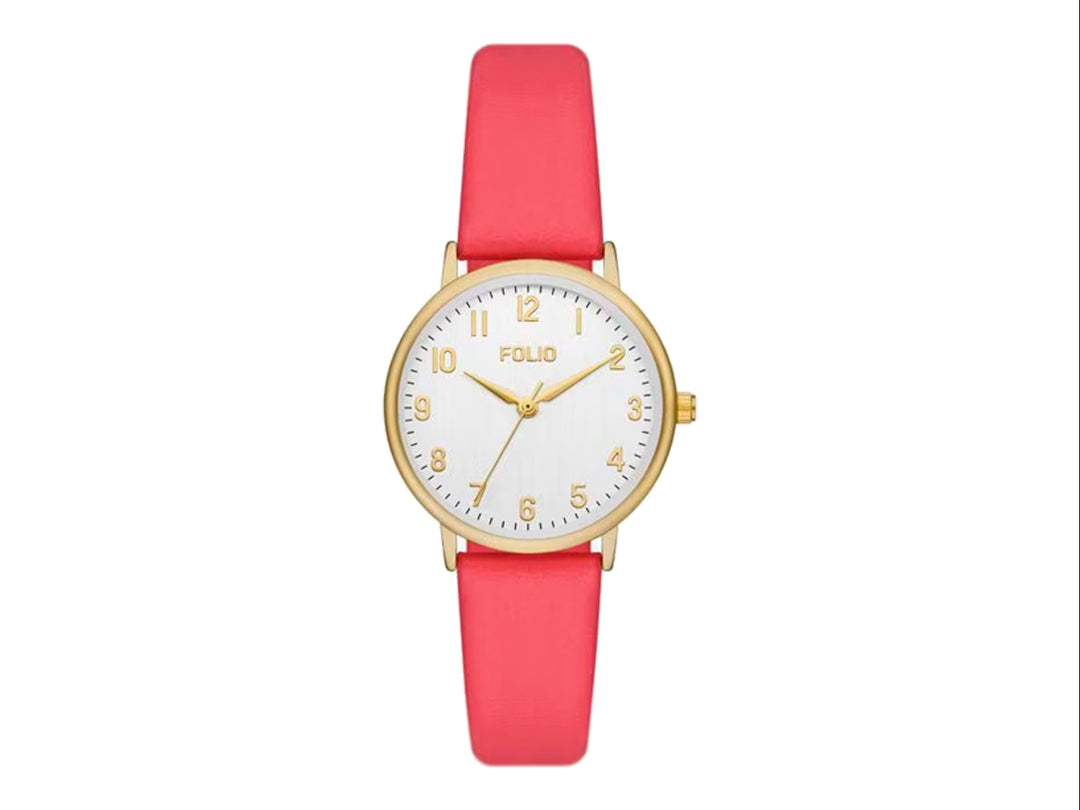 Set de 6 piezas que incluye un reloj analógico con correa coral y cinco pulseras doradas coordinadas.