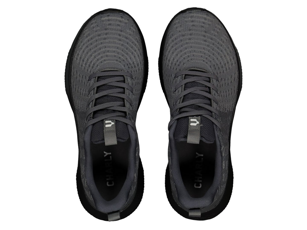 Tenis deportivos Charly color gris con suela negra y logotipo blanco lateral.