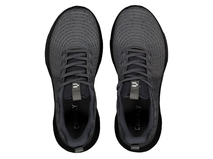 Tenis deportivos Charly color gris con suela negra y logotipo blanco lateral.