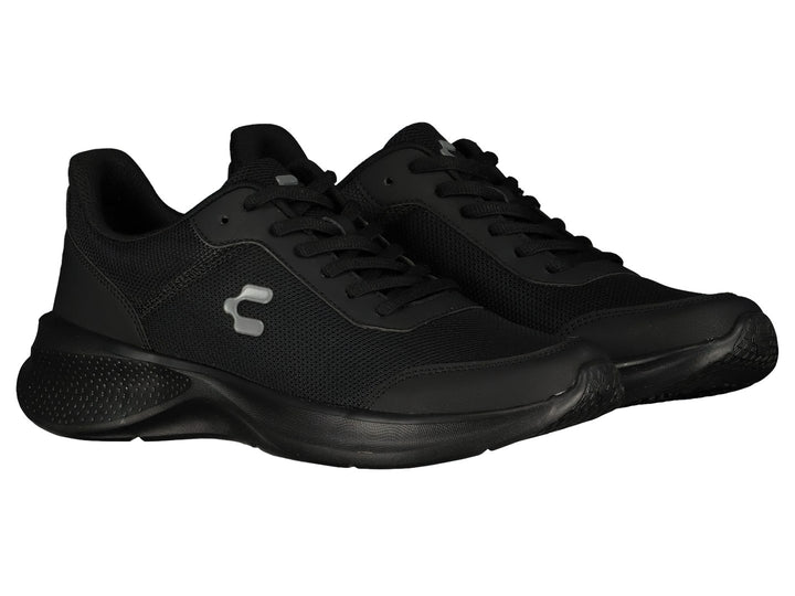 Par de tenis deportivos Charly en color negro con suela gruesa y tejido de malla.