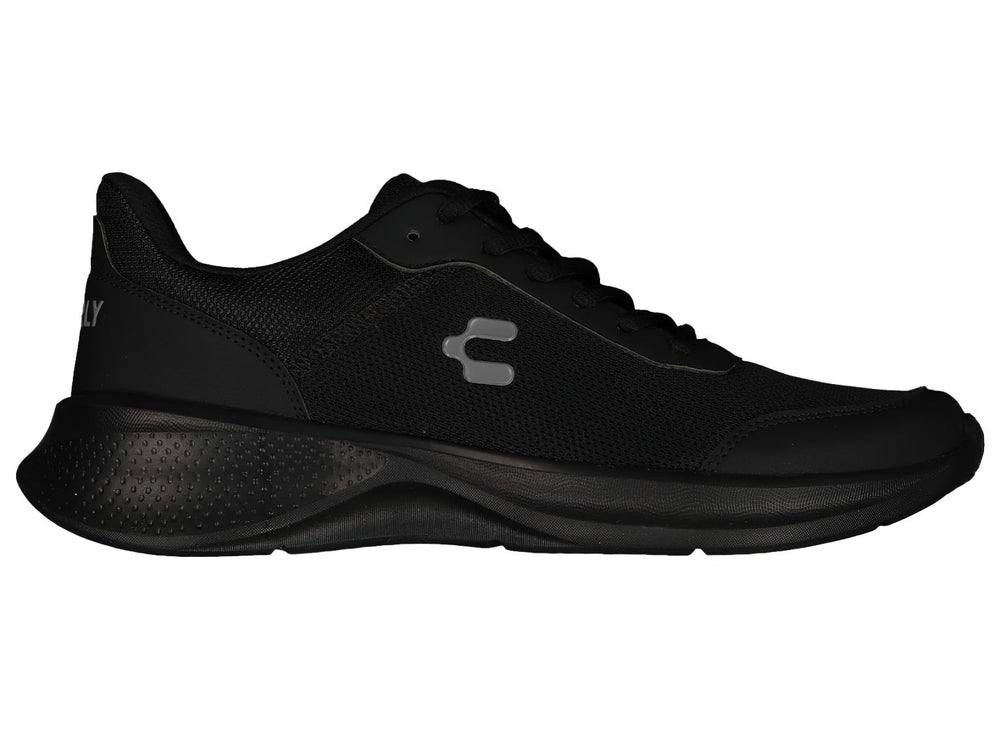 Par de tenis deportivos Charly en color negro con suela gruesa y tejido de malla.