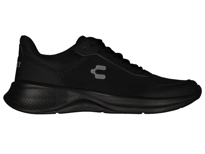 Par de tenis deportivos Charly en color negro con suela gruesa y tejido de malla.