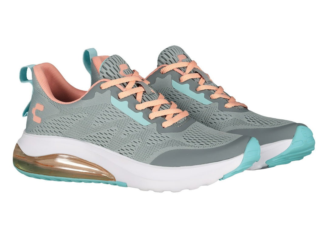 Tenis deportivos Charly color gris con detalles en coral y turquesa y suela blanca con cámara de aire.