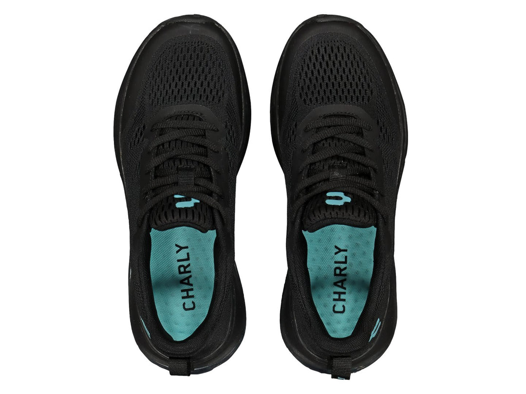 Tenis deportivos Charly color negro con detalles aqua y suela con cámara de aire transparente.